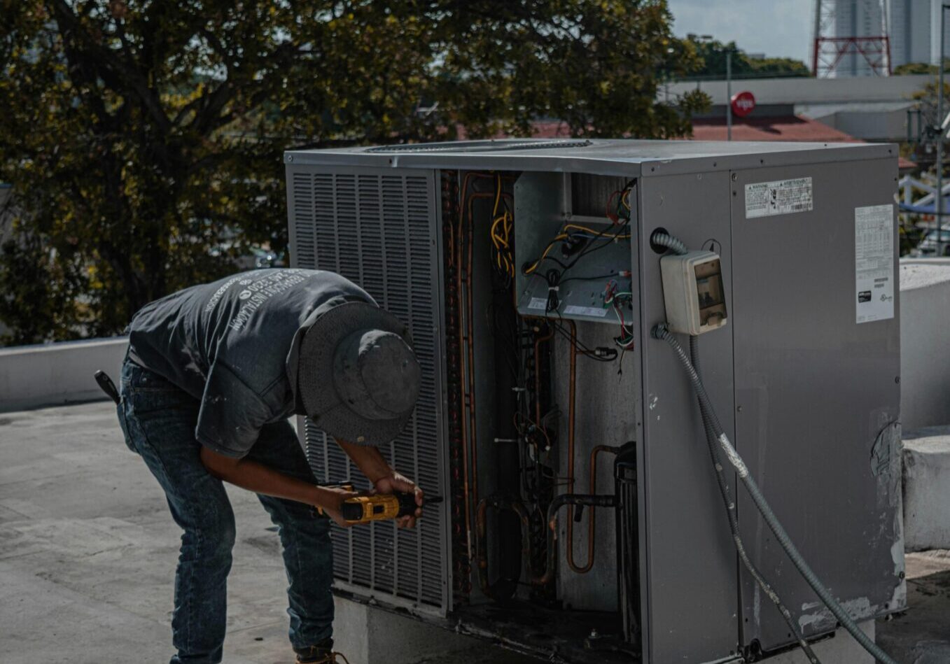 HVAC maintenance A man working on an industrial oven.